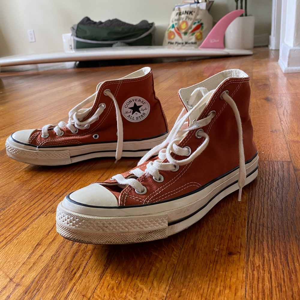 rust colored high-top converse